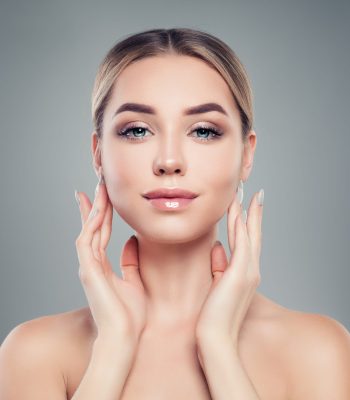 Beautiful young woman with healthy skin. Facial treatment, skincare and cosmetology concept