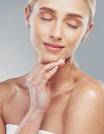 Beauty, skincare and face of a woman in studio for health, wellness and self care with cosmetics, makeup and dermatology product. Model posing for luxury facial, natural glow skin and self love.