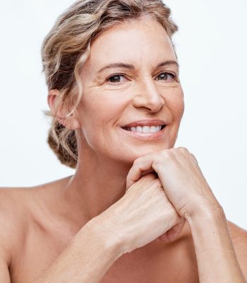 Shot of a beautiful mature woman posing against a white background.