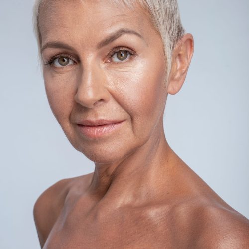 Close up of an attractive woman posing nude